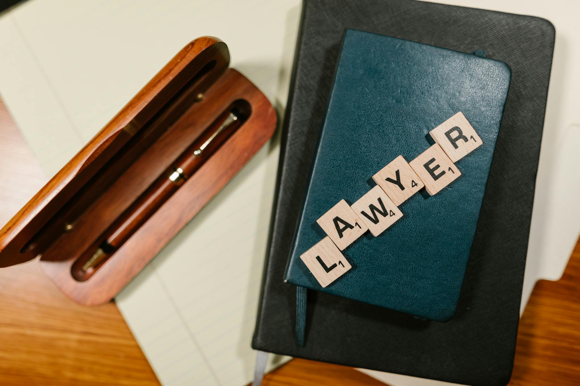 overhead shot of scrabble tiles on a notebook