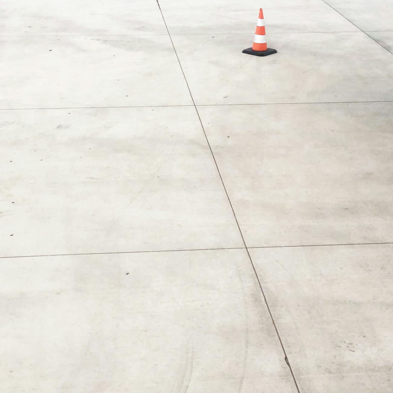 white and orange road safety cone