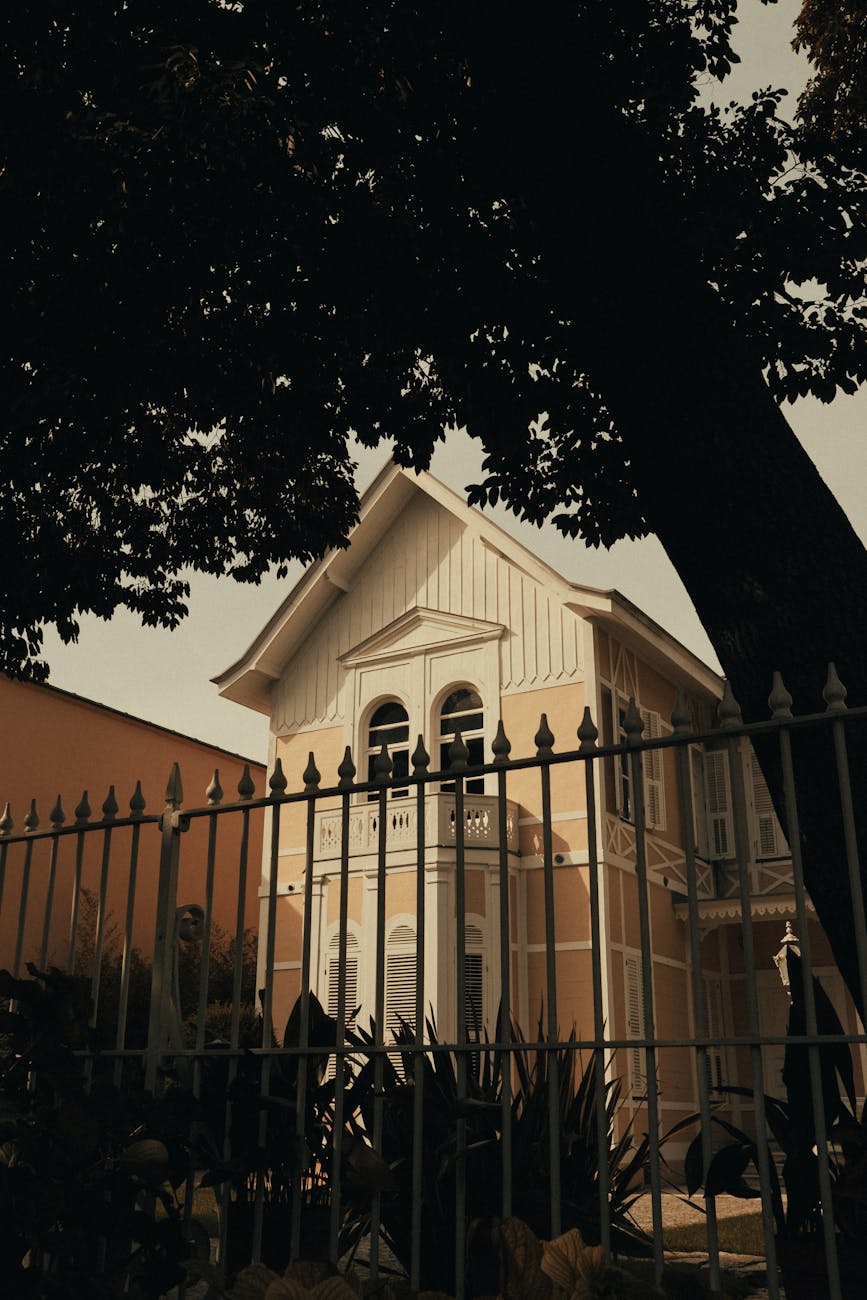 beautiful mansion behind fence