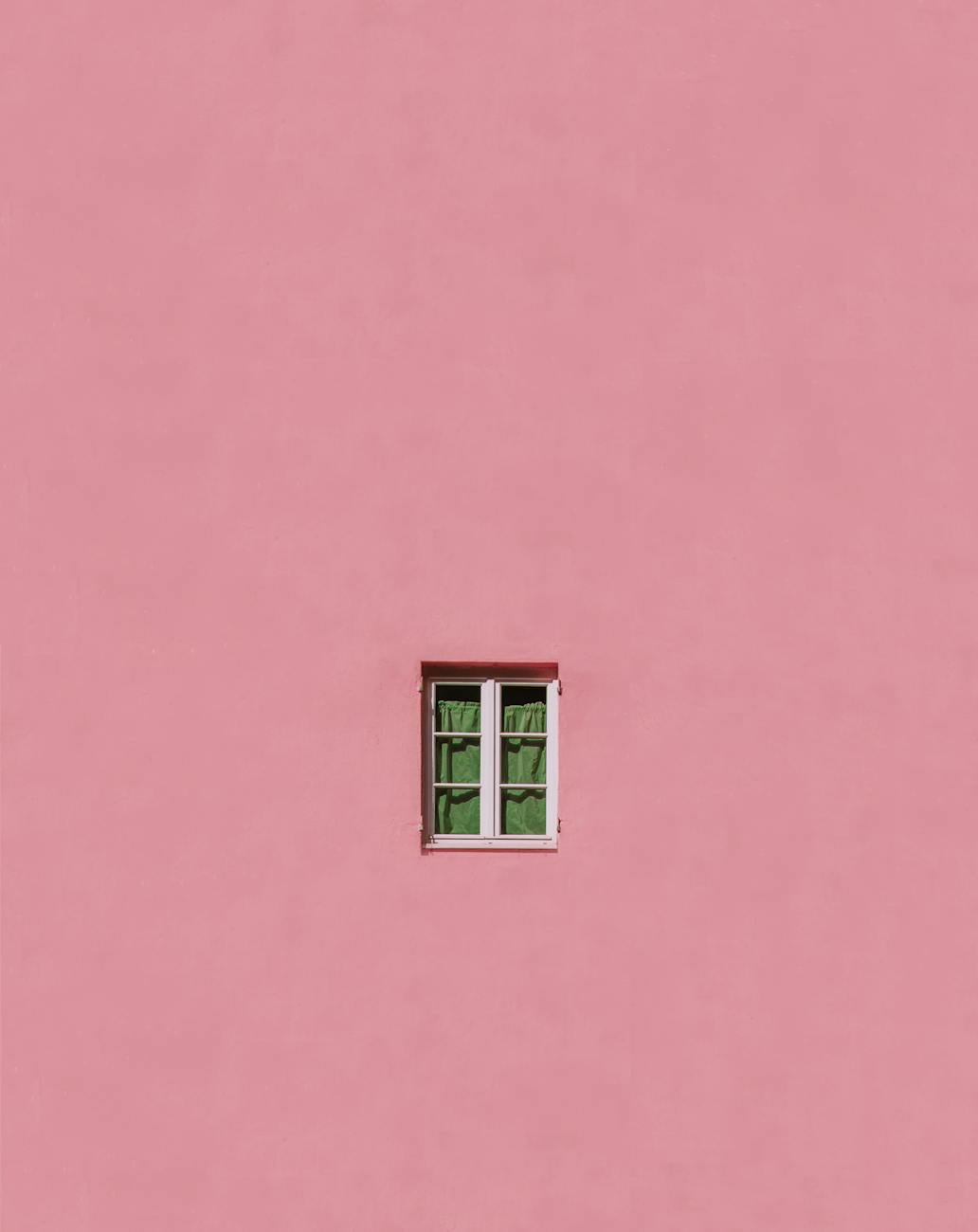 window on pink wall